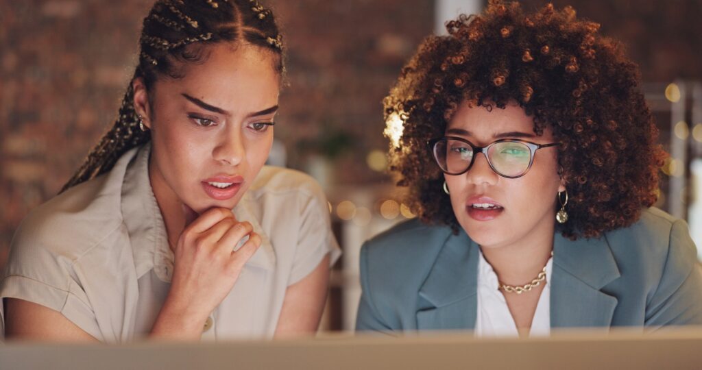 Business, women and employees with planning, conversation and brainstorming in workplace. Female co